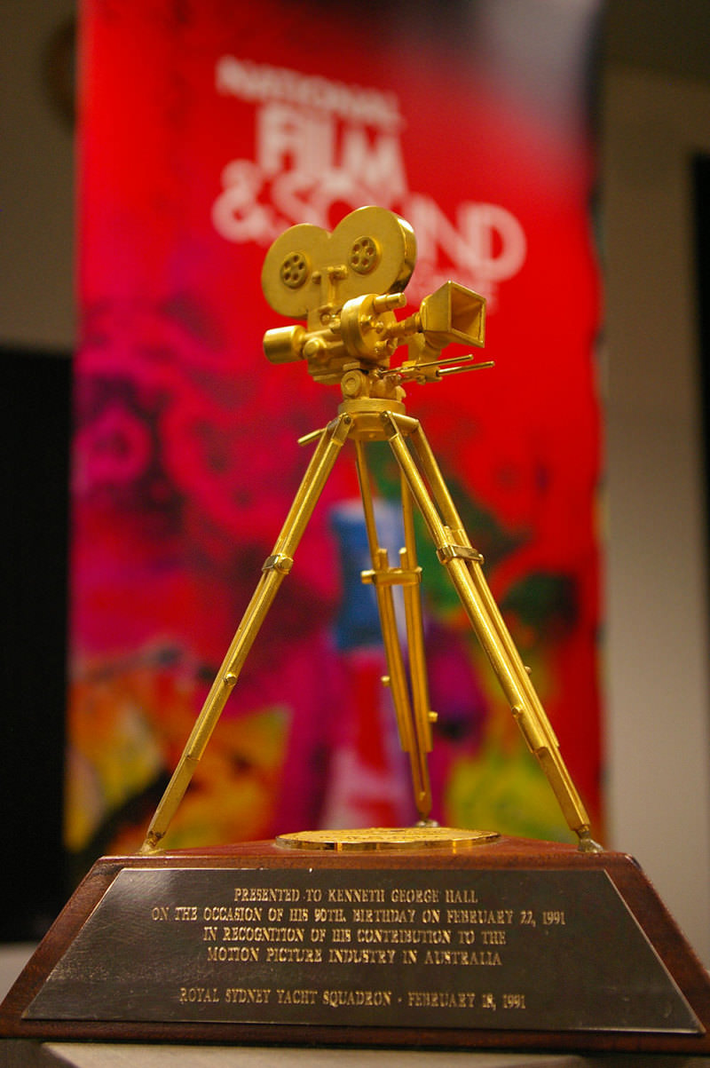 The Ken G Hall Film Preservation Award, a gold tripod camera on a wooden base